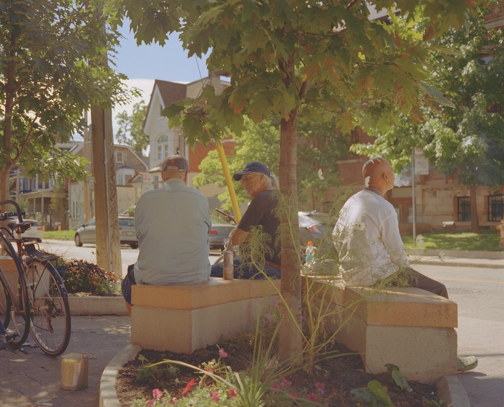 Three men sitting talking